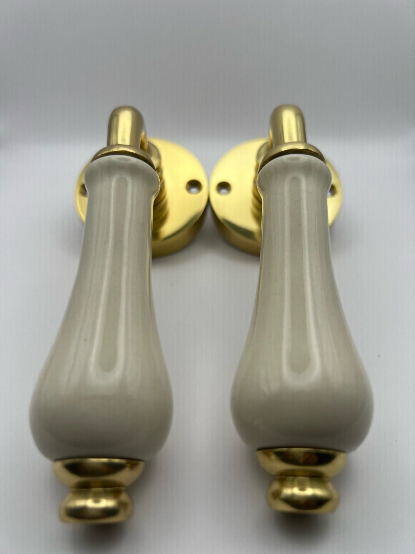 B&M Vintage Brass Lever on Rose with Ivory Porcelain Handle Polished Brass