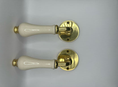 B&M Vintage Brass Lever on Rose with Ivory Porcelain Handle Polished Brass