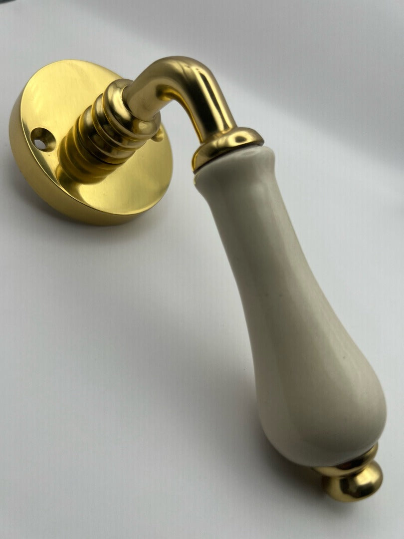 B&M Vintage Brass Lever on Rose with Ivory Porcelain Handle Polished Brass