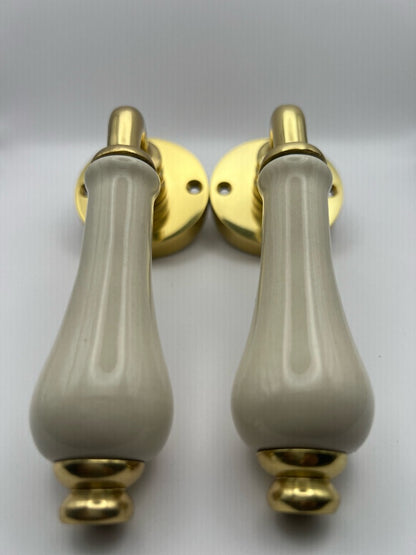 B&M Vintage Brass Lever on Rose with Ivory Porcelain Handle Polished Brass
