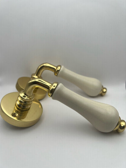 B&M Vintage Brass Lever on Rose with Ivory Porcelain Handle Polished Brass